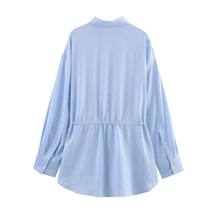 Back view of light blue shirt showing drawstring waist detail and sleeve cuffs