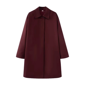 Minimalist burgundy long coat with lapel and button detail, elegant oversized style