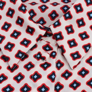 Detailed view of the vintage pop art geometric print collar and matching buttons