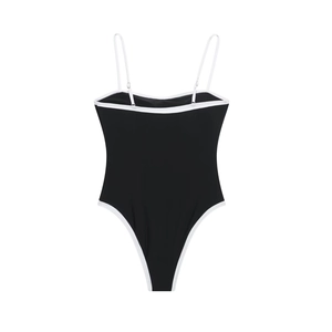 Detailed view of adjustable thin white straps and piping on black one-piece bodysuit