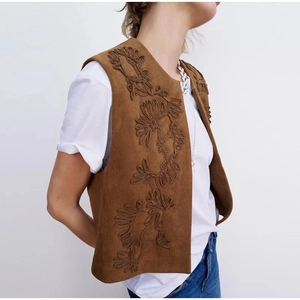 Vintage brown suede vest for women featuring detailed floral embroidery in a cropped fit