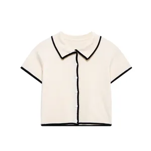 Elegant white knit polo top with black contrast trim and buttons for women