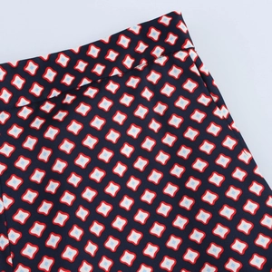 Detailed view of dark blue geometric print on high-quality woven silk satin fabric