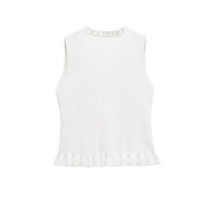 Close-up of white knitted sleeveless vest featuring delicate lettuce edge trim and round neck