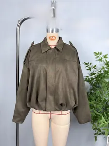 Detail view of khaki faux suede bomber jacket with shoulder tabs and elastic hem