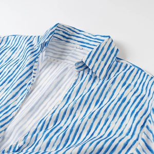 Detail of blue and white striped cotton-linen shirt collar with size S label