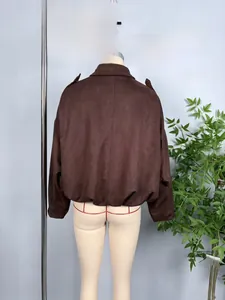 Detail view of brown faux suede bomber jacket with elasticated hem and drop shoulder