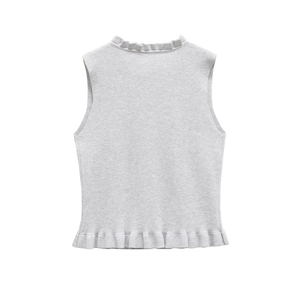 Detailed view of soft knit sleeveless top with delicate ruffle trim edges in light grey