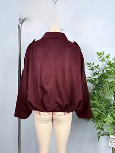 Detail view of burgundy faux suede jacket back featuring high-quality matte texture