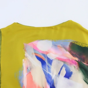 Mustard yellow sleeveless round neck dress featuring an abstract art print design