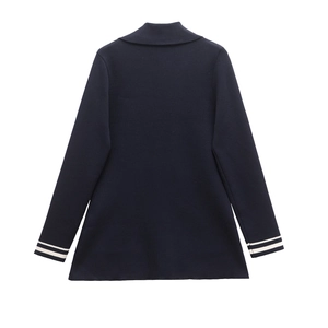 Navy blue double-breasted knit blazer with white striped cuffs and wide lapels, back view
