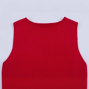 Women's sleeveless red knit dress with a deep V-neck and slimming pleated design