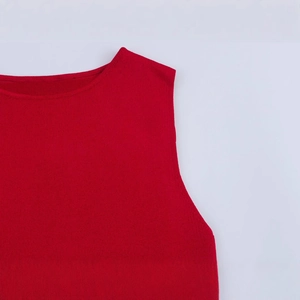 Elegant sleeveless red knit maxi dress with a deep V-neck and slim fit pleated design