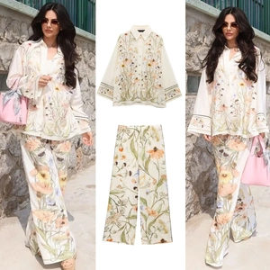 Women's two-piece floral print set with long sleeve button shirt and wide leg trousers