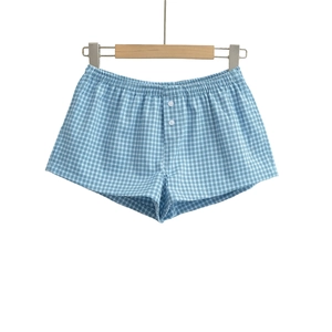 Detail view of light blue checkered cotton shorts with elastic waist and button fly