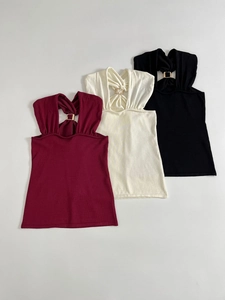Three-pack of slim fit halter tops in burgundy, beige, and black with metal ring detail
