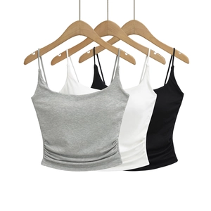 Cropped camisole tops with thin straps and side ruching in grey, white, and black colors