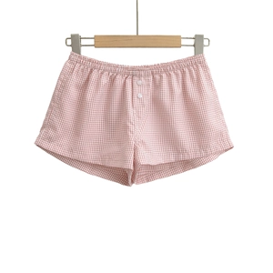 Women's pink gingham high-waisted shorts with elastic waistband and button detail