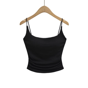 Detail view of the black slim fit tank top featuring thin straps and ruched side stitching