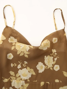 Detail of French floral chiffon dress with ruffled cowl neck and silk-like texture