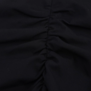 Detail of elegant ruching and pleated texture on this black midi dress fabric