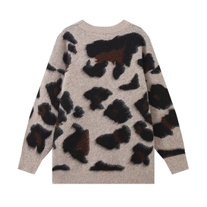 Detail of premium fuzzy leopard print knit sweater showing rich mohair texture and ribbed hem
