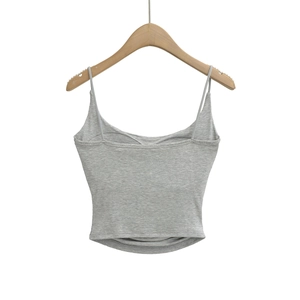 Detail of light gray knitted tank top with thin straps and fine ribbed texture