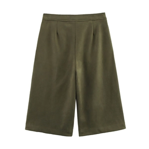 Detail of army green wide-leg trousers with pleated waist and premium suede texture