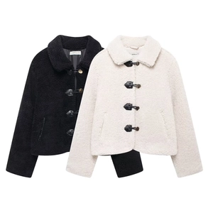 Detail of faux shearling cropped jacket featuring toggle buttons and lapel collar