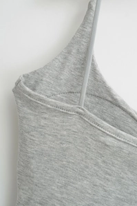 Close-up of heather grey camisole showing thin shoulder straps and fine knit texture