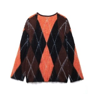 Women's crewneck knit cardigan featuring orange and black argyle pattern in mohair texture