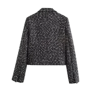 Back view of a black and white textured tweed cropped jacket with long sleeves and H-line cut