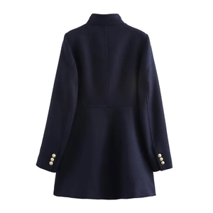 Detail view of navy blue coat back with slim tailoring and gold buttons on cuffs