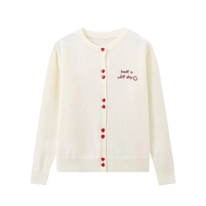 Women's cream knit cardigan with red heart buttons and 'have a nice day' embroidery detail