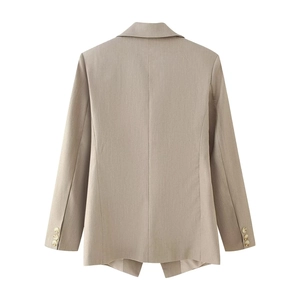 Women's tailored khaki blazer with cinched waist and buttoned cuffs, back view, street style