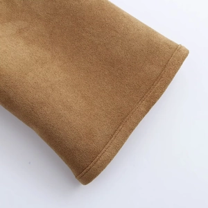 Detailed macro view showing the clean stitching on a thick brown suede winter coat fabric