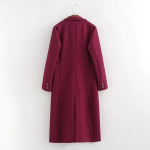 Detail view of the back of a burgundy long wool coat featuring sleeve buttons and a back slit