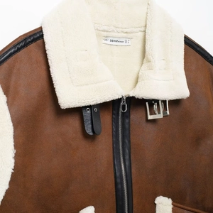 Women's brown faux suede shearling biker vest with plush faux fur trim and metal hardware