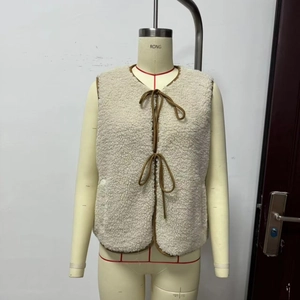 Women street fashion cream fleece vest with brown trim and front bow tie closures