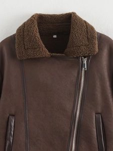 Detail of dark brown faux suede bomber jacket with faux shearling collar and size S tag