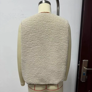 Back view of a trendy white fleece vest for women featuring warm faux shearling material