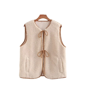 Women street fashion fleece vest in cream with brown trim and tie closure