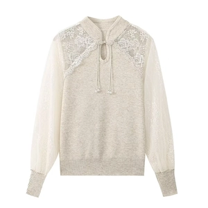 Detail of vintage knit top with Chinese bead buttons and elegant floral lace patchwork