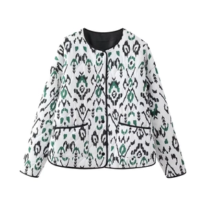 Detailed view of quilted cotton jacket featuring ethnic pattern and black trim edges