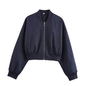 Detail of navy blue short bomber jacket showing metal zipper and ribbed cuffs