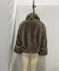 Rear view of a premium dark brown faux fur jacket with a thick collar and wide cuffs