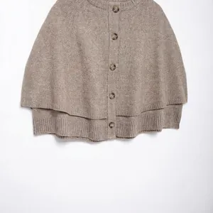 Women's knit cape jacket with round neck and buttons in soft oatmeal beige color