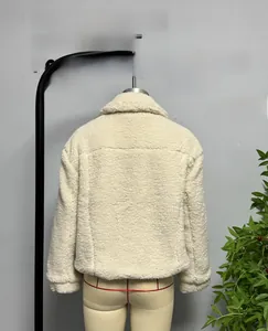 Detail shot of the back of a cream fleece jacket with a classic wide collar