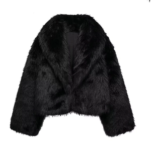 Detail of premium black faux fur texture with wide lapel and smooth lining on jacket
