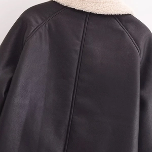 Women's black faux leather jacket with white shearling collar and back seam details